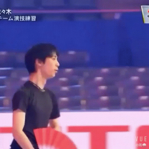 Man In Black Shirt At Red And White Vue Sign GIF