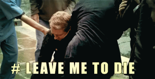 Man in Black Shirt Being Helped # Leave Me To Die