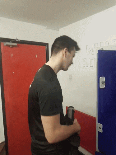 Man in Black Shirt by Wall With Number 10