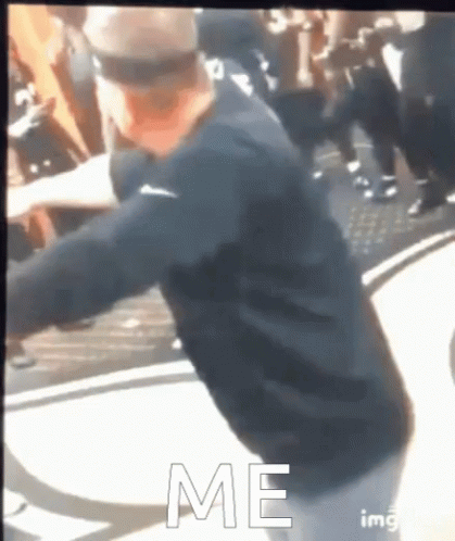 Man in Black Shirt Dancing Before Crowd Saying Me