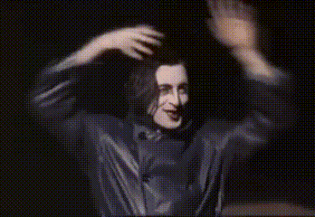 Man in Black Shirt Dancing in Dark Room