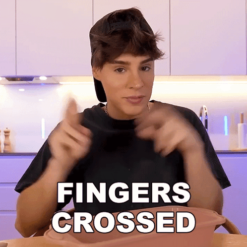 Man In Black Shirt Fingers Crossed GIF