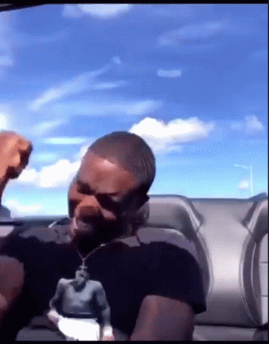 Man in Black Shirt Fist in Air
