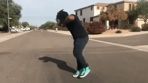 Man In Black Shirt Green Shoes Skateboard Trick GIF