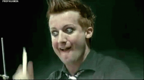 Man in Black Shirt Holding Candle Making Funny Face