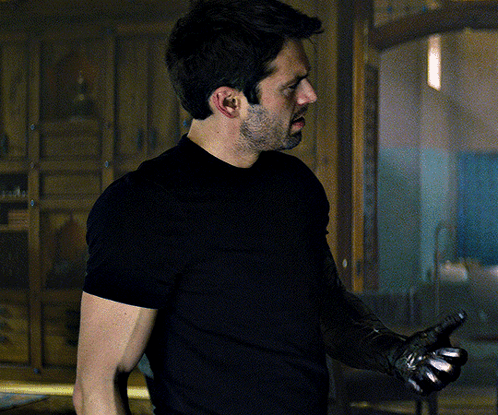 Man in Black Shirt Holding Gun