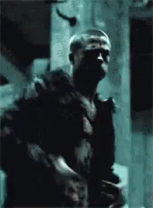 Man in Black Shirt Holding Gun