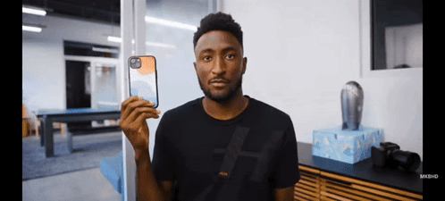 Man in Black Shirt Holding Phone