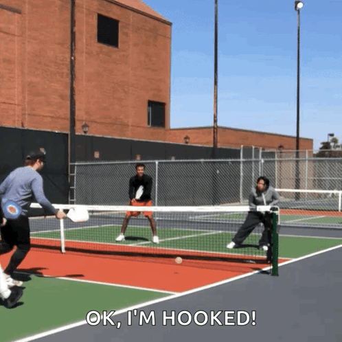 Man in Black Shirt Holding Tennis Racquet