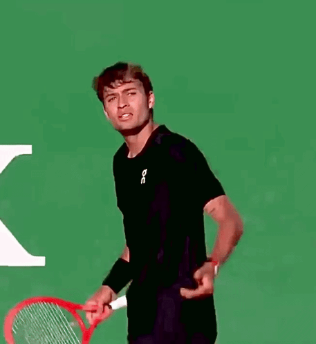 Man in Black Shirt Holding Tennis Racquet