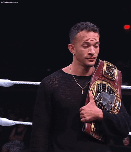 Man In Black Shirt Holding Wrestling Belt GIF