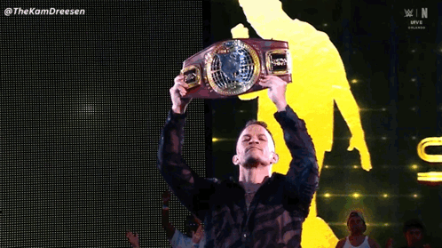 Man In Black Shirt Holding WWE Belt GIF
