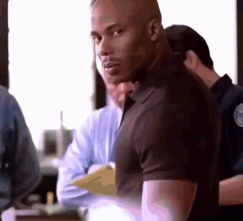 Man in Black Shirt in Crowd