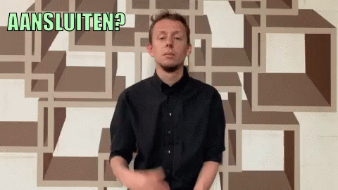 Man in Black Shirt in Front of Aansluiten Wall
