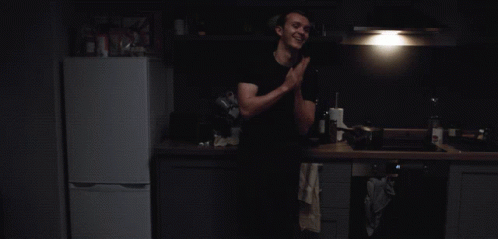 Man in Black Shirt in Kitchen
