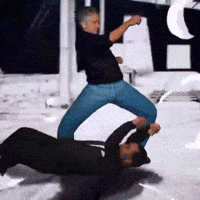 Man In Black Shirt Kicking Another Man GIF