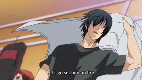 Man in Black Shirt Laying on Bed Says Let's Go Set Him on Fire
