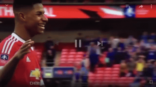Man In Black Shirt Makes Funny Face To Crowd GIF