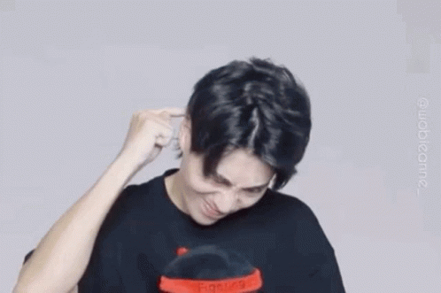 Man in Black Shirt Making Funny Face Holding Hand to Ear