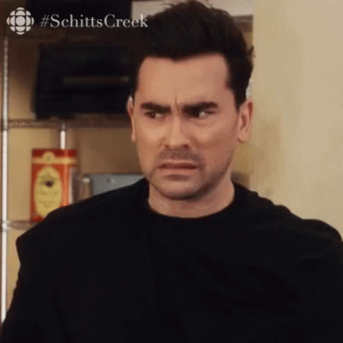 Man in Black Shirt Making Funny Face Looking at Camera