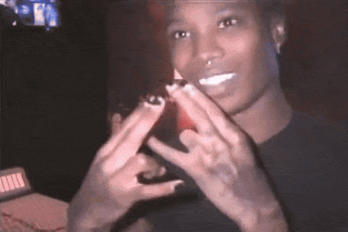 Man In Black Shirt Making Peace Sign GIF