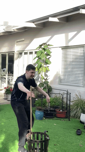 Man In Black Shirt On Green Lawn GIF