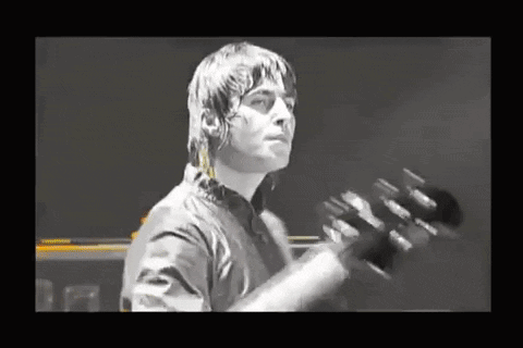 Man in Black Shirt Playing Guitar