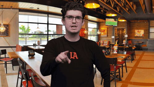 Man in Black Shirt Pointing
