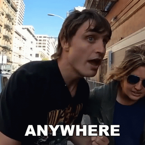 Man in Black Shirt Saying Anywhere