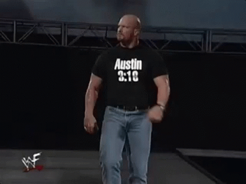 Man in Black Shirt Saying Austin 3:16 Walking Down Stage