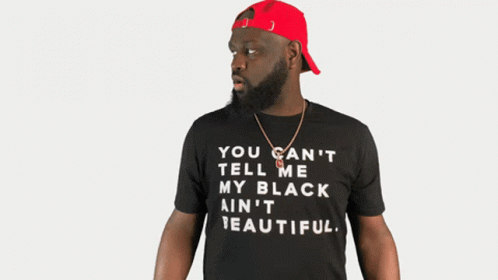 Man in Black Shirt Saying Black Is Beautiful