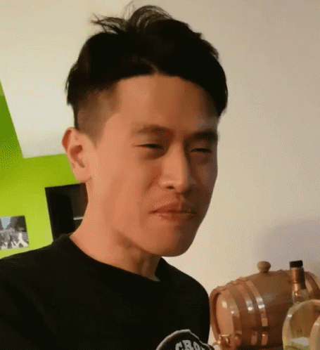 Man In Black Shirt Saying Crouching Tigers GIF
