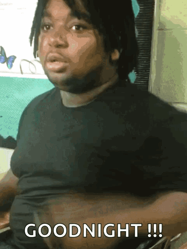 Man in Black Shirt Saying Goodnight
