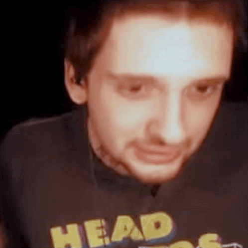 Man in Black Shirt Saying Head