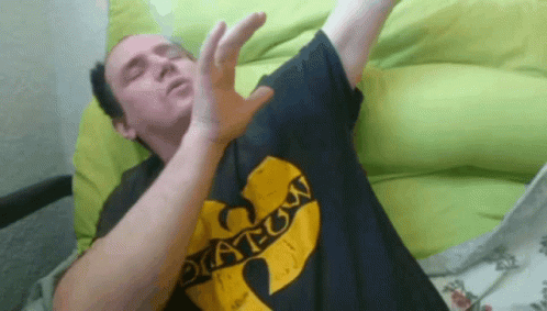 Man in Black Shirt Saying Wu Tang