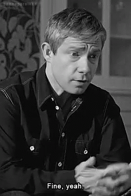 Man in Black Shirt Sitting and Talking