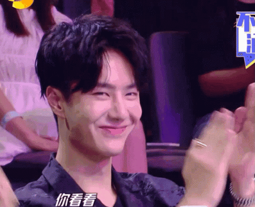 Man In Black Shirt Smiling And Clapping GIF