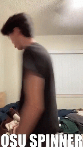 Man in Black Shirt Standing at Window Osu Spinner