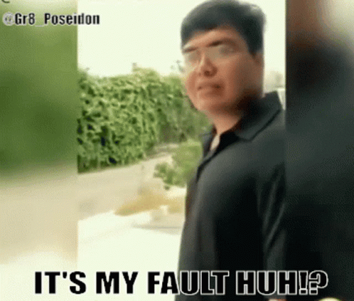Man In Black Shirt Standing Before Fault Sign GIF