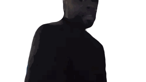 Man in Black Shirt Standing in Darkness