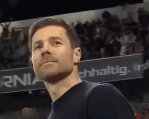Man in Black Shirt Standing in Stadium
