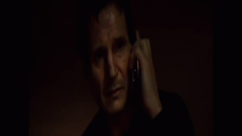Man In Black Shirt Talking On Cell Phone GIF