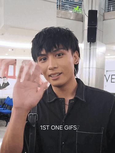 Man in Black Shirt Waving Hand