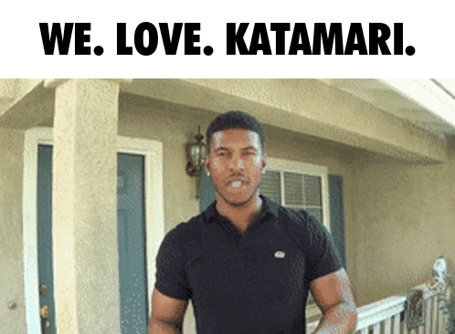 Man in Black Shirt We Love Katamari in Front of House
