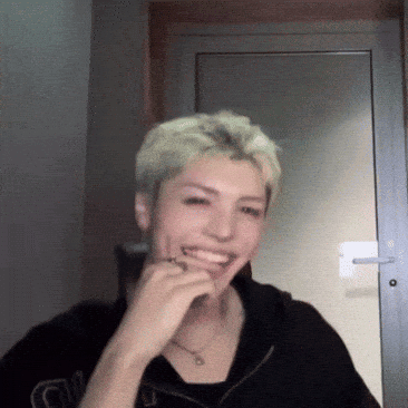 Man in Black Shirt with G Laughing