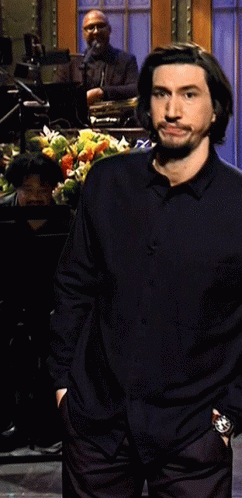 Man In Black Shirt With Hands In Pockets On Stage GIF
