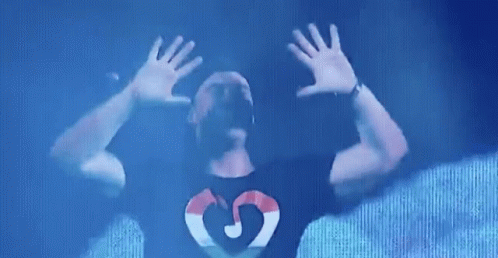 Man in Black Shirt With Heart and Letter G