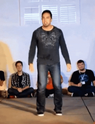 Man In Black Shirt With Lion GIF