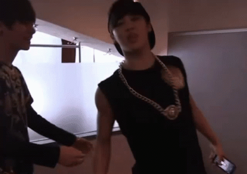 Man In Black Shirt With Neck Chain GIF