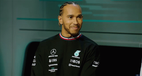 Man In Black Shirt With Petronas Ineos And UBS Logos GIF